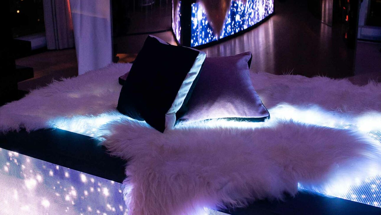 lounge seating at a party in a dark room.