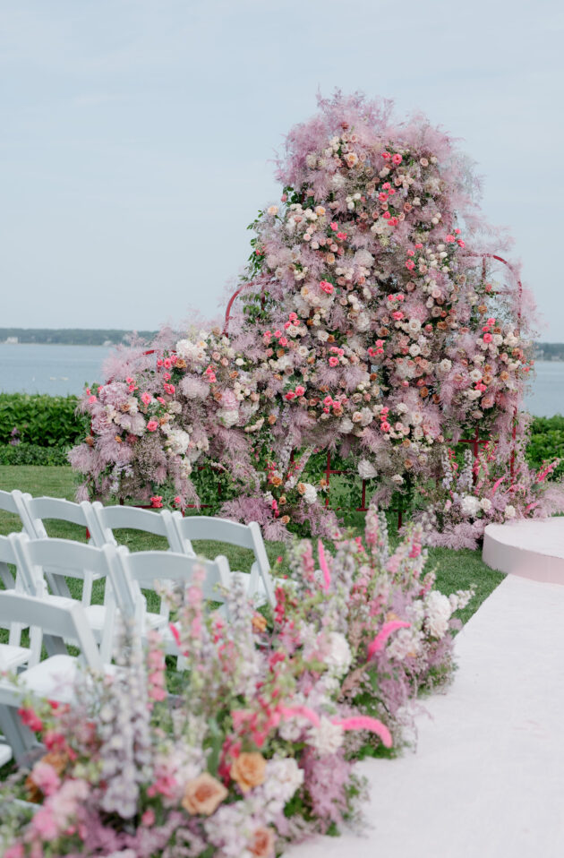 Martha's Vineyard Destination Wedding Ceremony Decor. Pink, white and purple florals along ceremony aisle. Designed by  JWennes Events.
