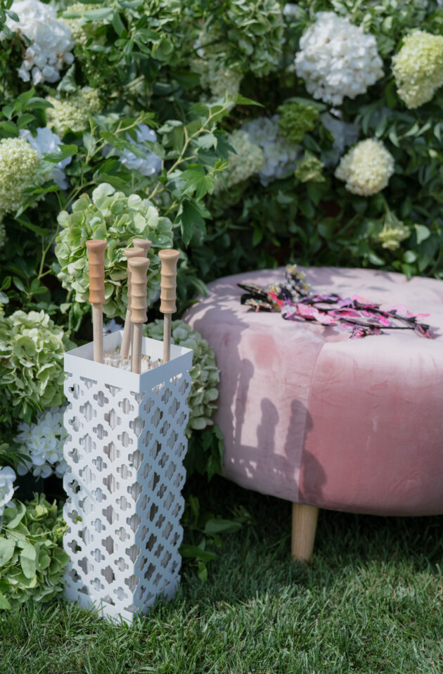 Martha's Vineyard Destination Wedding Ceremony Decor. Pink velvet seating and umbrellas for guests. Designed by  JWennes Events.