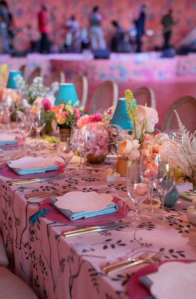 Extravagant wedding reception table decor with custom floral linens. Designed by  JWennes Events.